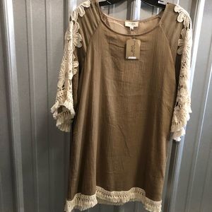 Woven shift dress with Crochet details.